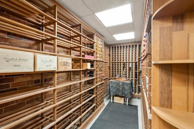 wine room featuring a paneled ceiling