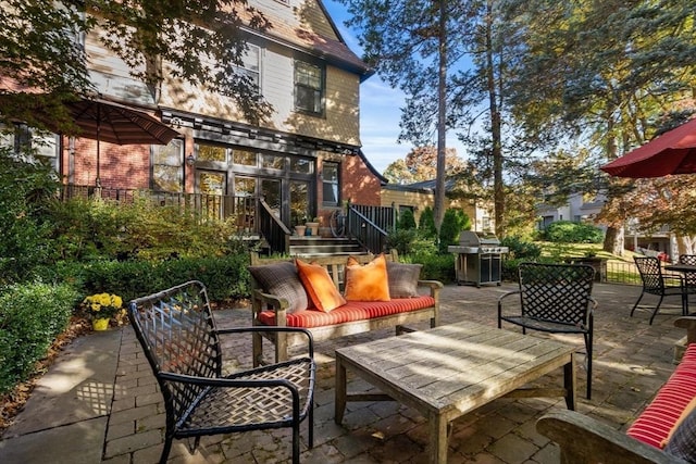 view of patio / terrace with grilling area and a wooden deck