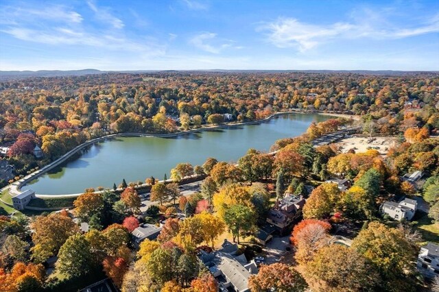 aerial view featuring a water view and a forest view