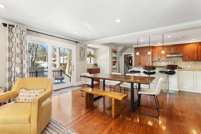 dining space with hardwood / wood-style flooring