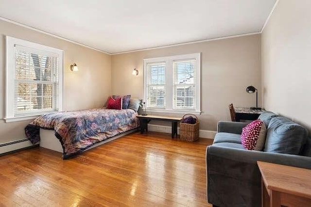 bedroom with hardwood / wood-style flooring and crown molding