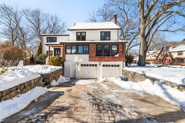 view of front of property with a garage