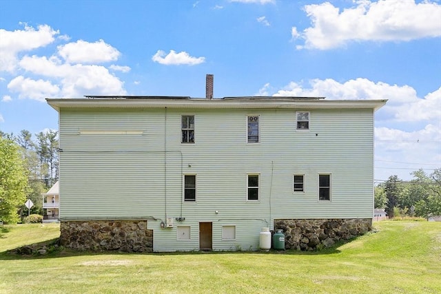 436 Maple St, Winchendon, MA 01475 - rear view of property featuring a lawn, a chimney, and stone siding