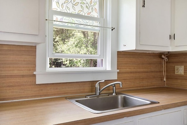 436 Maple St, Winchendon, MA 01475 - kitchen featuring white cabinetry, light countertops, and backsplash