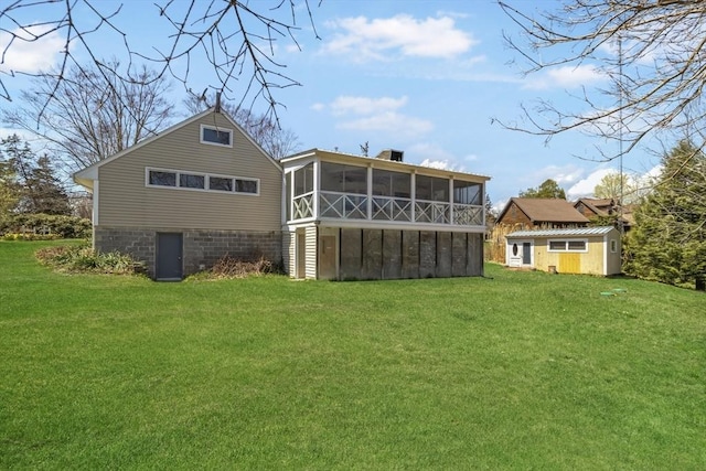 51 S St, Granby, MA 01033 - rear view of property with a sunroom, a yard, and an outdoor structure