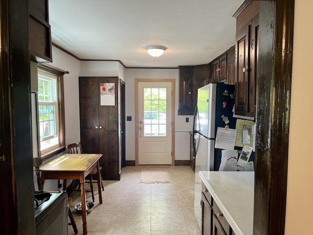 kitchen with dark brown cabinets and light countertops