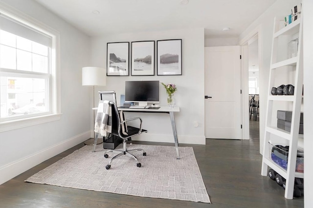 office space with dark wood-type flooring