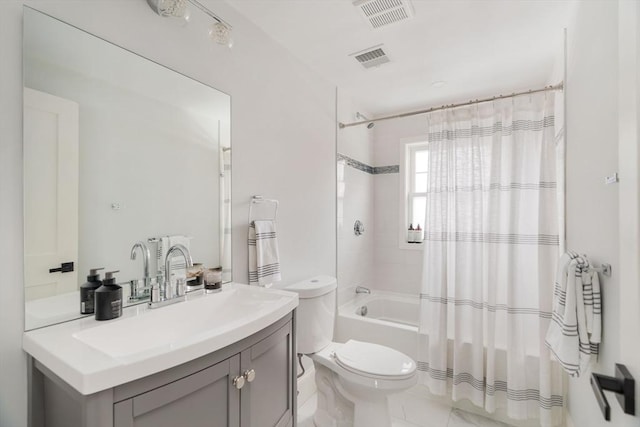 full bathroom with shower / bath combo with shower curtain, toilet, and vanity