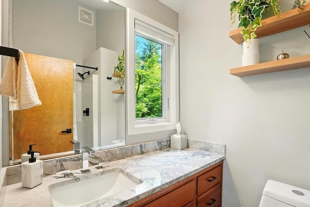 13 Robinwood Rd, Acton, MA 01720 - bathroom featuring toilet, vanity, and a shower