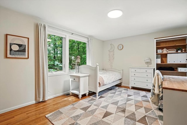 13 Robinwood Rd, Acton, MA 01720 - bedroom with light wood-type flooring and baseboards