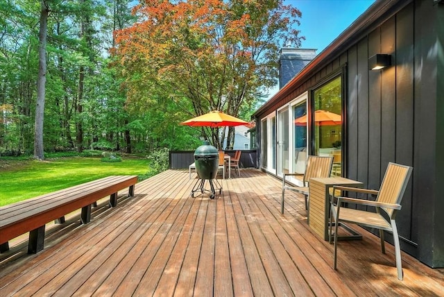 13 Robinwood Rd, Acton, MA 01720 - wooden deck with outdoor dining area and a lawn