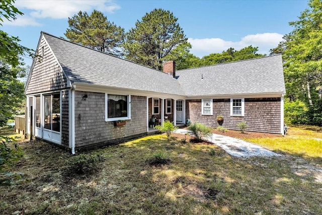 3 Five Cors, Barnstable, MA 02632 - view of front of property with a chimney, roof with shingles, and a front lawn
