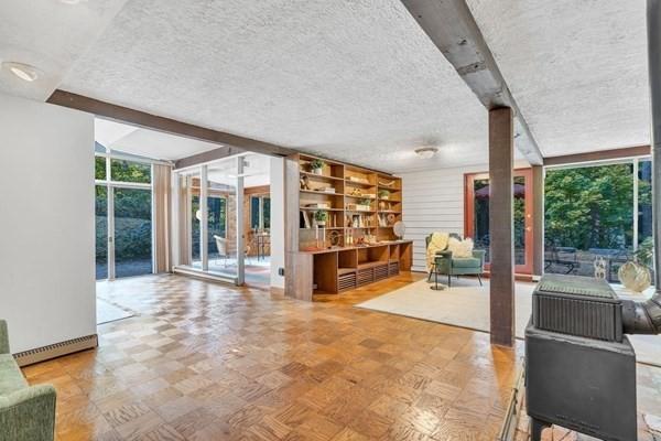 interior space with a wall of windows and a textured ceiling