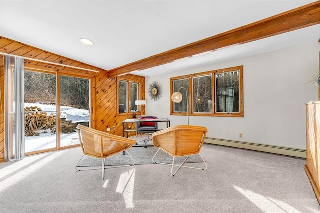 sitting room featuring carpet floors, beam ceiling, wooden walls, and baseboard heating