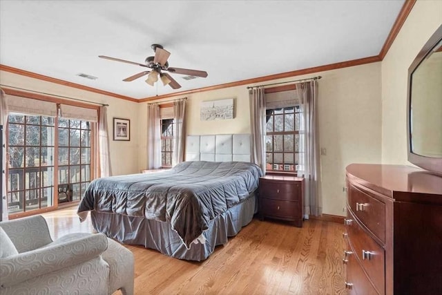 bedroom featuring ceiling fan, ornamental molding, light hardwood / wood-style floors, and multiple windows