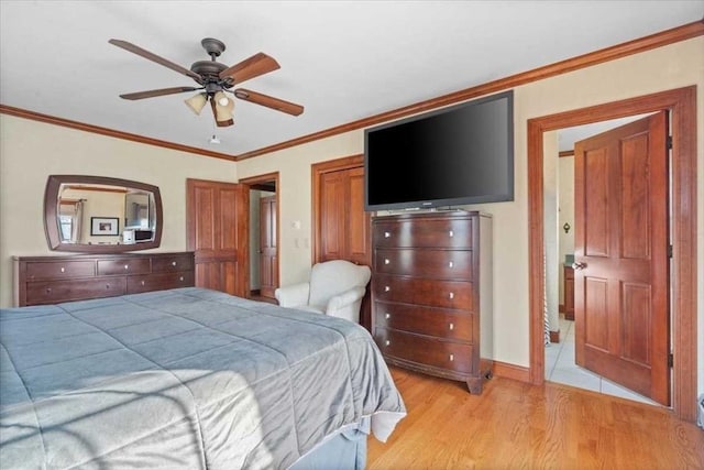 bedroom featuring ceiling fan, crown molding, and light hardwood / wood-style flooring