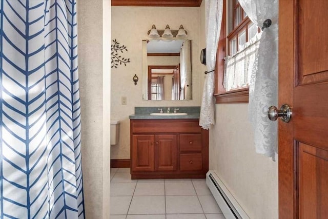 bathroom with a baseboard radiator, tile patterned flooring, vanity, a shower with curtain, and crown molding