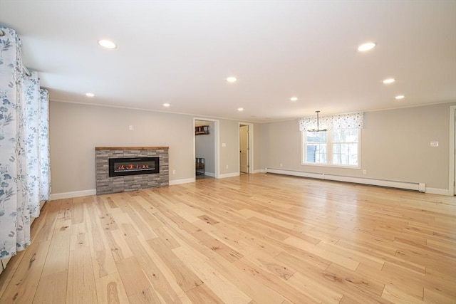 3 Woods Rd, Westminster, MA 01473 - unfurnished living room featuring light wood-type flooring, a baseboard radiator, a fireplace, and recessed lighting