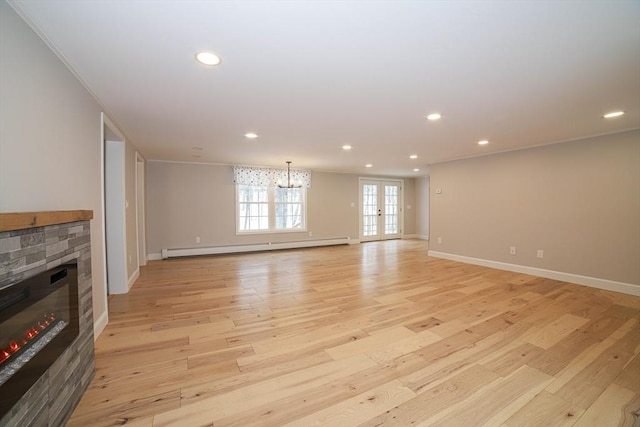 3 Woods Rd, Westminster, MA 01473 - unfurnished living room featuring crown molding, a stone fireplace, a baseboard radiator, and light wood-style floors