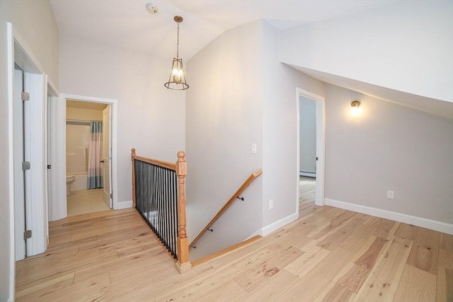 3 Woods Rd, Westminster, MA 01473 - hall with lofted ceiling, light wood-style flooring, an upstairs landing, and baseboards