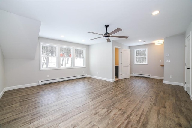 3 Woods Rd, Westminster, MA 01473 - unfurnished living room featuring a baseboard radiator, baseboards, wood finished floors, and recessed lighting