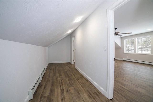 3 Woods Rd, Westminster, MA 01473 - bonus room with dark wood-style floors, a baseboard radiator, lofted ceiling, and baseboards