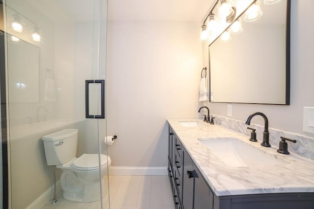 3 Woods Rd, Westminster, MA 01473 - bathroom with toilet, double vanity, baseboards, and a sink