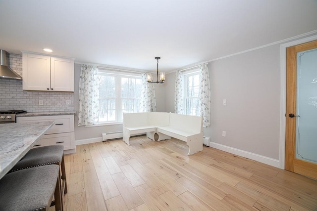 3 Woods Rd, Westminster, MA 01473 - unfurnished dining area with light wood-style flooring, crown molding, baseboards, and a wealth of natural light