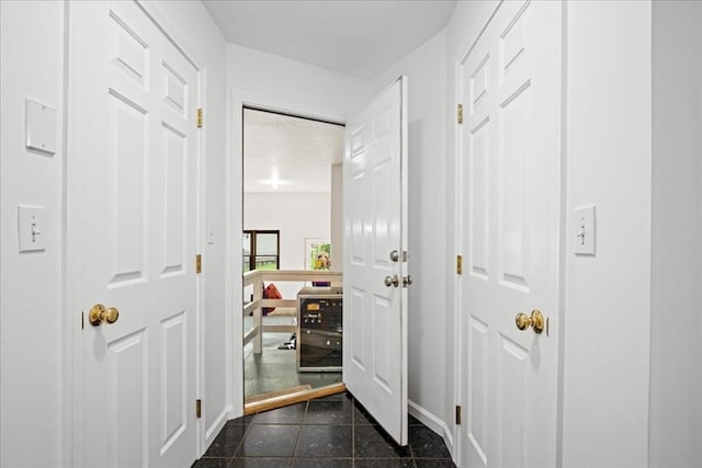 14 Vanessa Dr, Northborough, MA 01532 - doorway with wine cooler and dark tile patterned floors