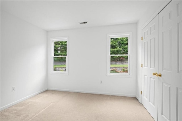 14 Vanessa Dr, Northborough, MA 01532 - unfurnished bedroom featuring multiple windows, light carpet, and a closet