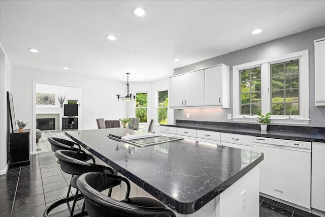 14 Vanessa Dr, Northborough, MA 01532 - kitchen featuring dishwasher, recessed lighting, a kitchen island, white cabinetry, and a breakfast bar area