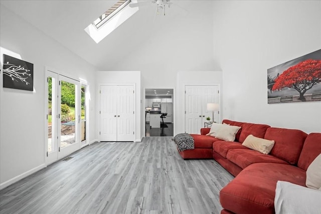 14 Vanessa Dr, Northborough, MA 01532 - living room featuring high vaulted ceiling, a skylight, wood finished floors, and ceiling fan