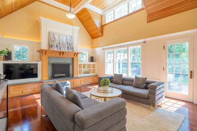 living room with dark hardwood / wood-style flooring, high vaulted ceiling, a healthy amount of sunlight, and wood ceiling