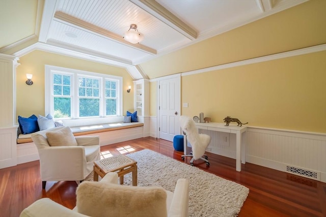 sitting room featuring vaulted ceiling with beams, dark wood-type flooring, and ornate columns