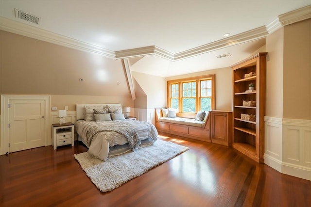 bedroom featuring crown molding and dark wood-type flooring