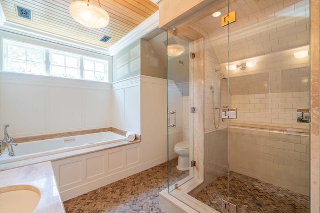 full bathroom featuring ornamental molding, separate shower and tub, vanity, and toilet