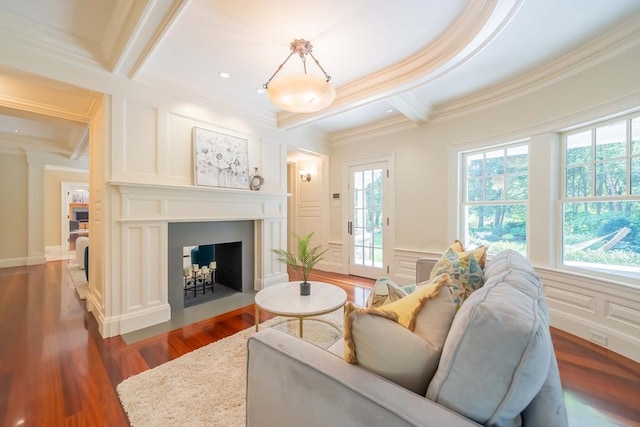 living room featuring dark wood-type flooring, ornamental molding, beam ceiling, and coffered ceiling