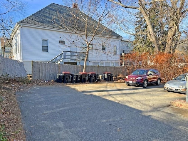 view of car parking with fence