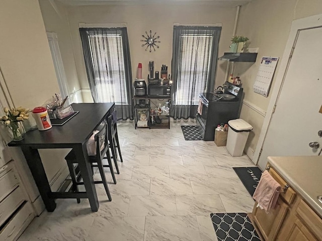 dining space with marble finish floor