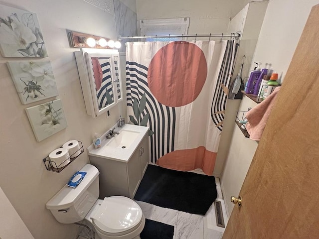 bathroom with a shower with curtain, toilet, and vanity