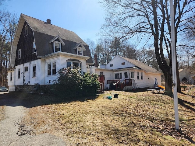 889 Amesbury Rd, Haverhill, MA 01830 - view of property exterior with a chimney
