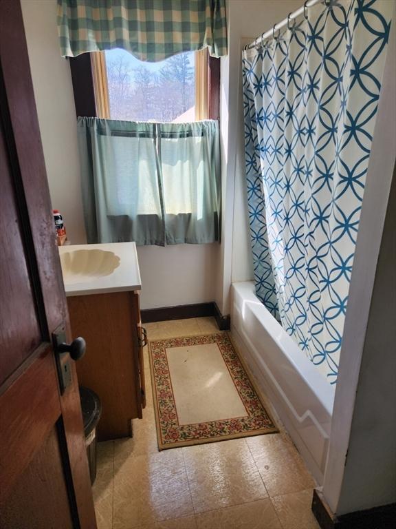 889 Amesbury Rd, Haverhill, MA 01830 - bathroom with vanity and shower / bath combo with shower curtain