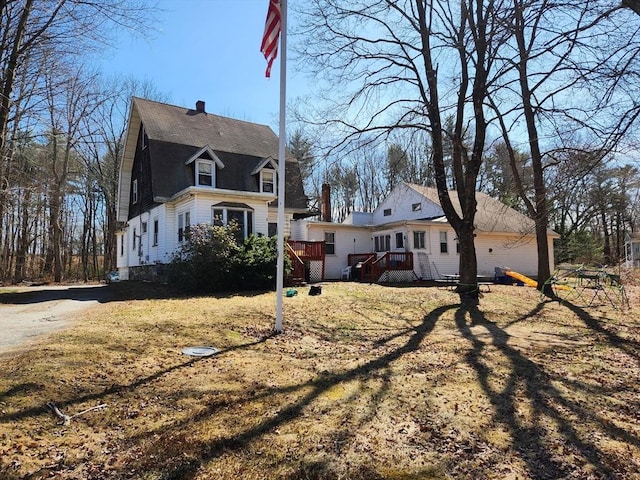 889 Amesbury Rd, Haverhill, MA 01830 - rear view of property with a wooden deck and a chimney