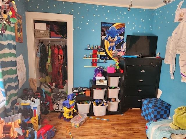889 Amesbury Rd, Haverhill, MA 01830 - bedroom featuring wood-type flooring, ornamental molding, and a closet