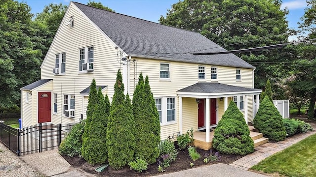 10 Carlisle Rd Unit 10, Bedford, MA 01730 - view of front of house featuring a shingled roof and covered porch