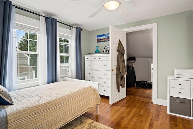 10 Carlisle Rd Unit 10, Bedford, MA 01730 - bedroom with wood finished floors, ceiling fan, and cooling unit
