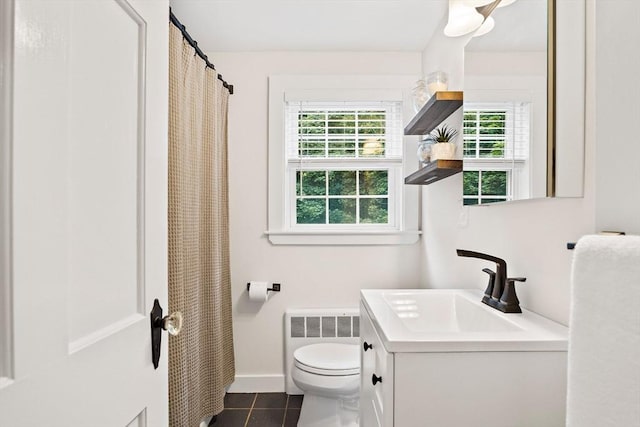 10 Carlisle Rd Unit 10, Bedford, MA 01730 - bathroom featuring plenty of natural light, tile patterned flooring, vanity, and radiator heating unit