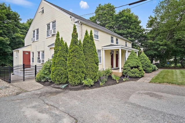 10 Carlisle Rd Unit 10, Bedford, MA 01730 - view of front of property featuring covered porch and cooling unit