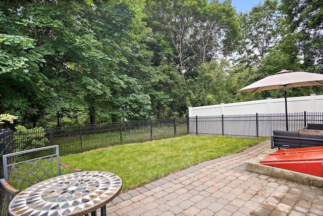 10 Carlisle Rd Unit 10, Bedford, MA 01730 - fenced backyard with a patio