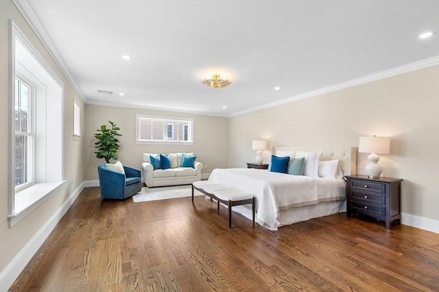 bedroom featuring ornamental molding, multiple windows, wood finished floors, and baseboards